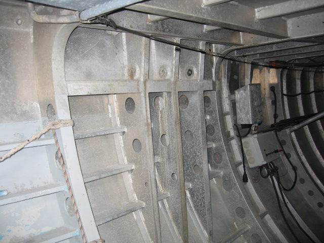 The inside of an aluminium American Cup yacht, showing the frames for the chain plates.